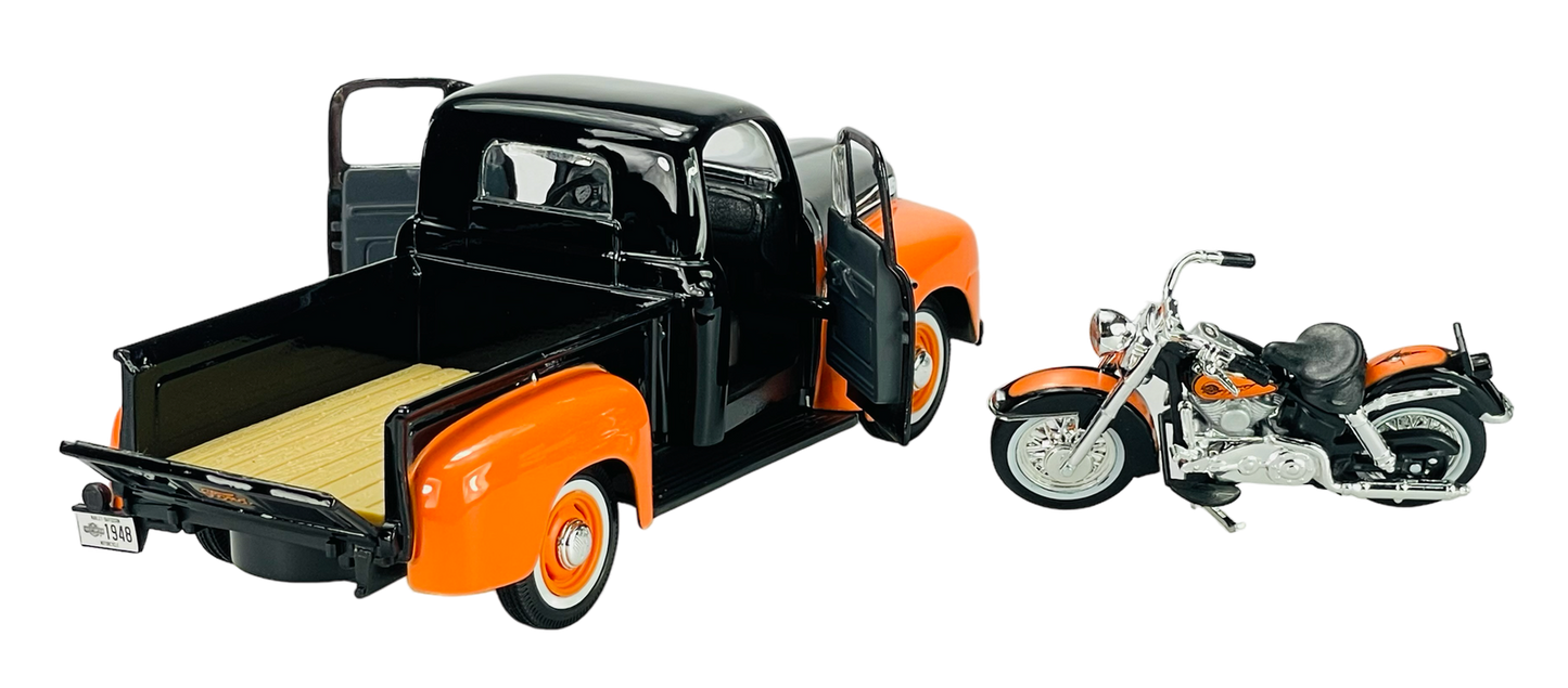 Model black and orange truck with motorcycle on white background