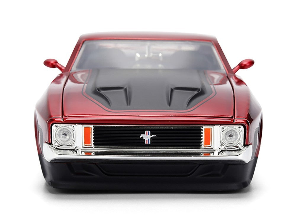Red classic car with a prominent grille on a white background