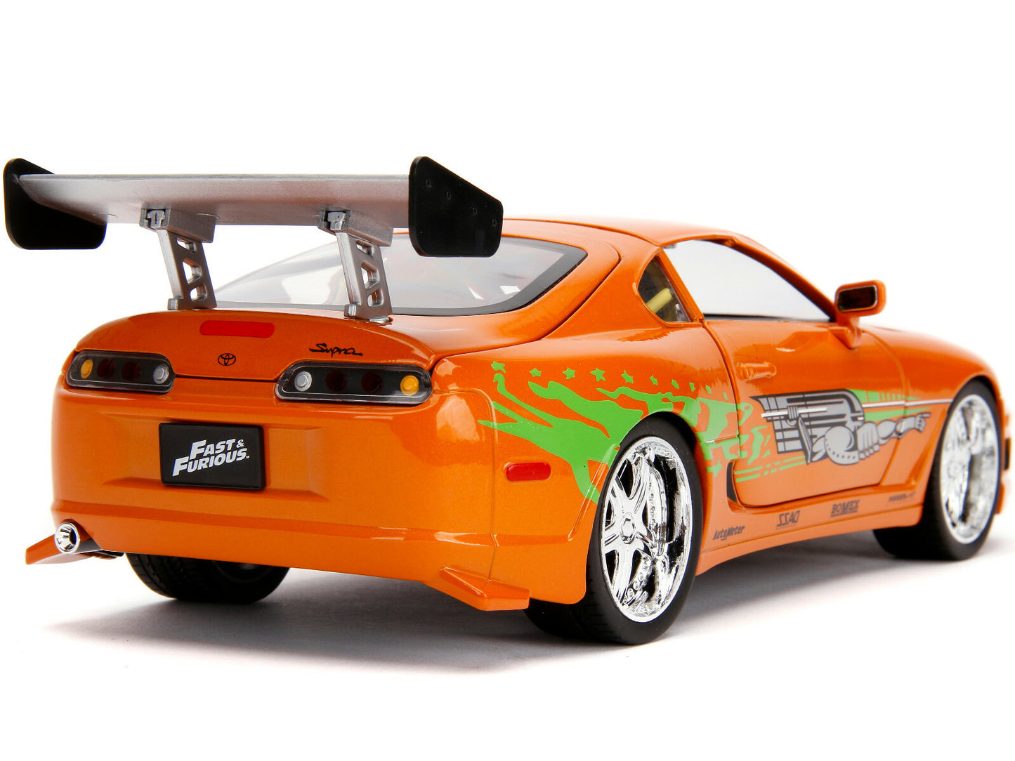 Orange toy car with a large rear wing on a white background