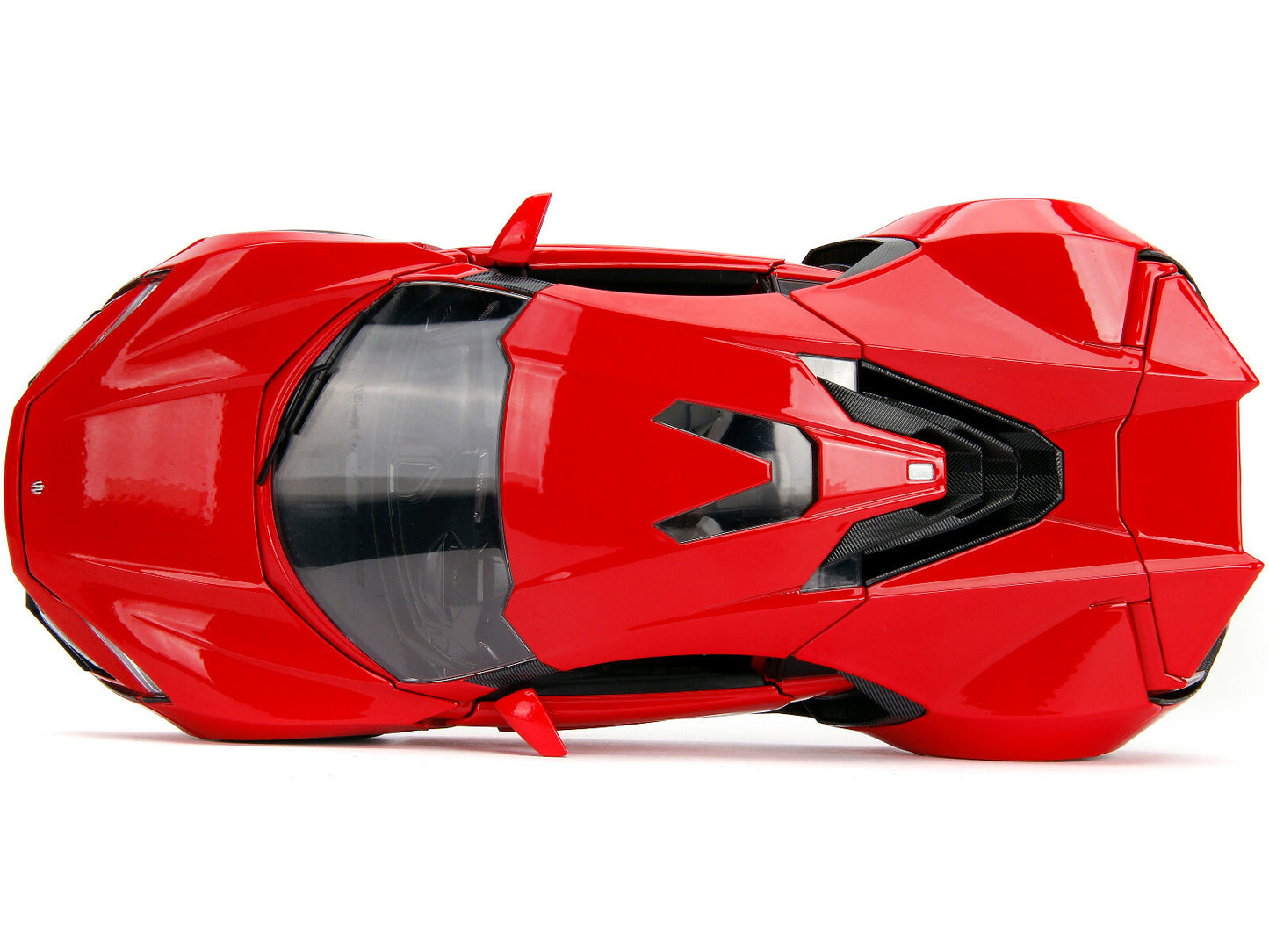 Red toy car with black accents on a white background