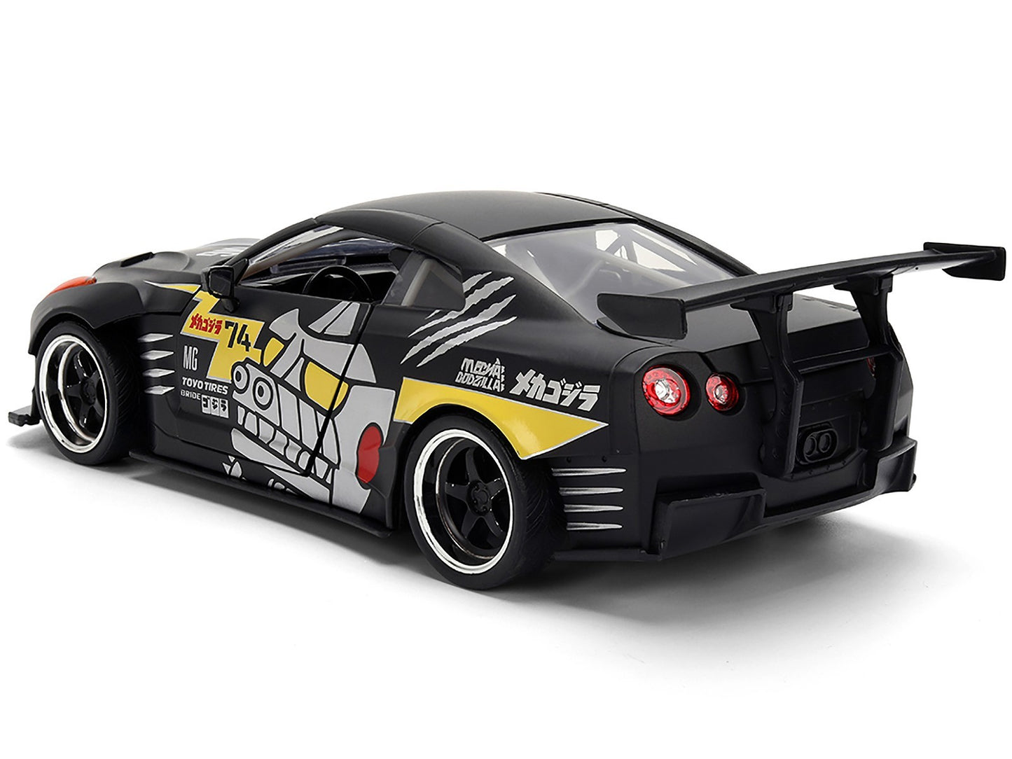 Black toy car with colorful graphics on a white background