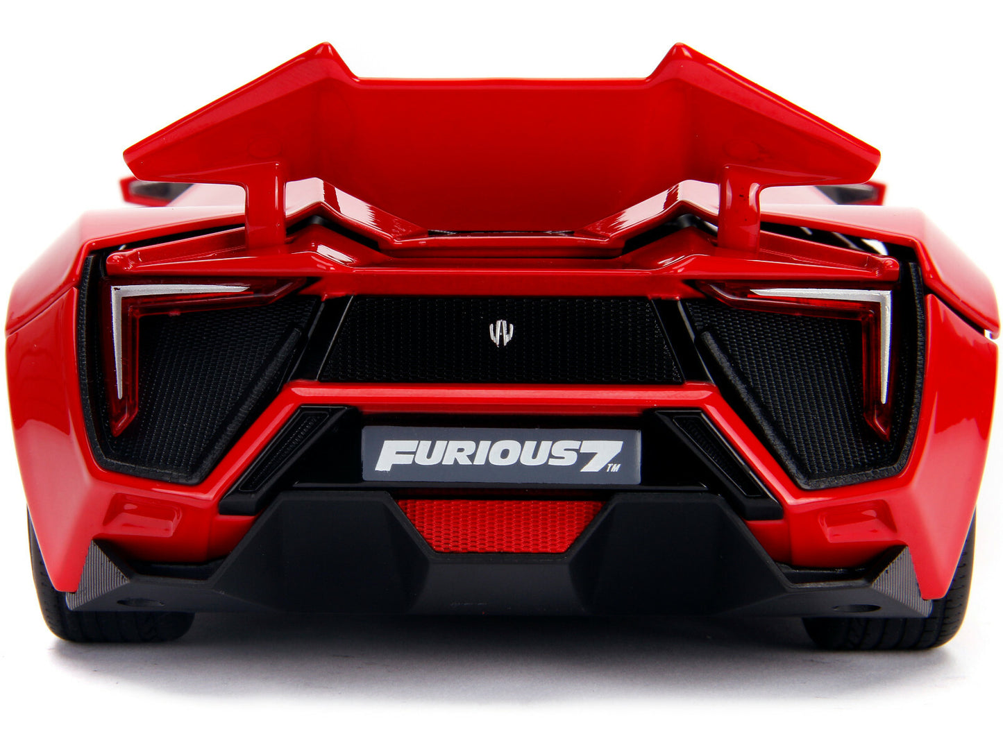 Red toy car with 'Furious 7' branding on a white background