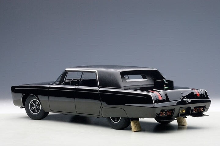 side angle view and back end of a black toy diecast model car