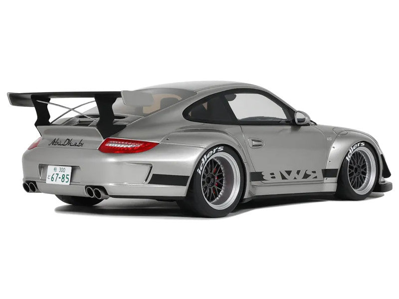 Silver sports car with a large rear wing on a white background