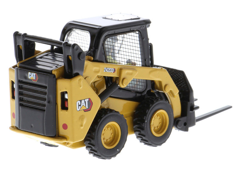 Toy skid steer loader with CAT branding on a white background