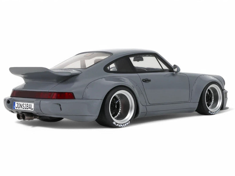 Gray sports car with a visible license plate on a white background