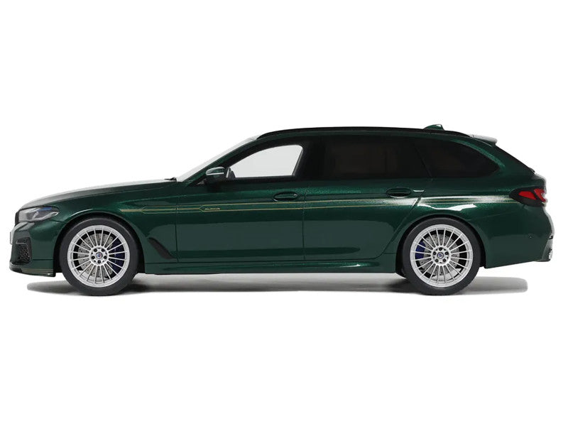 Green car side view on a white background