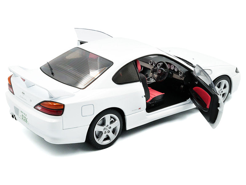 White sports car with open doors on a white background