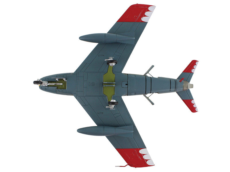 Model airplane with red and gray design on a white background