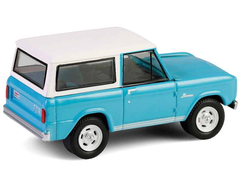 Model of a blue and white SUV on a white background
