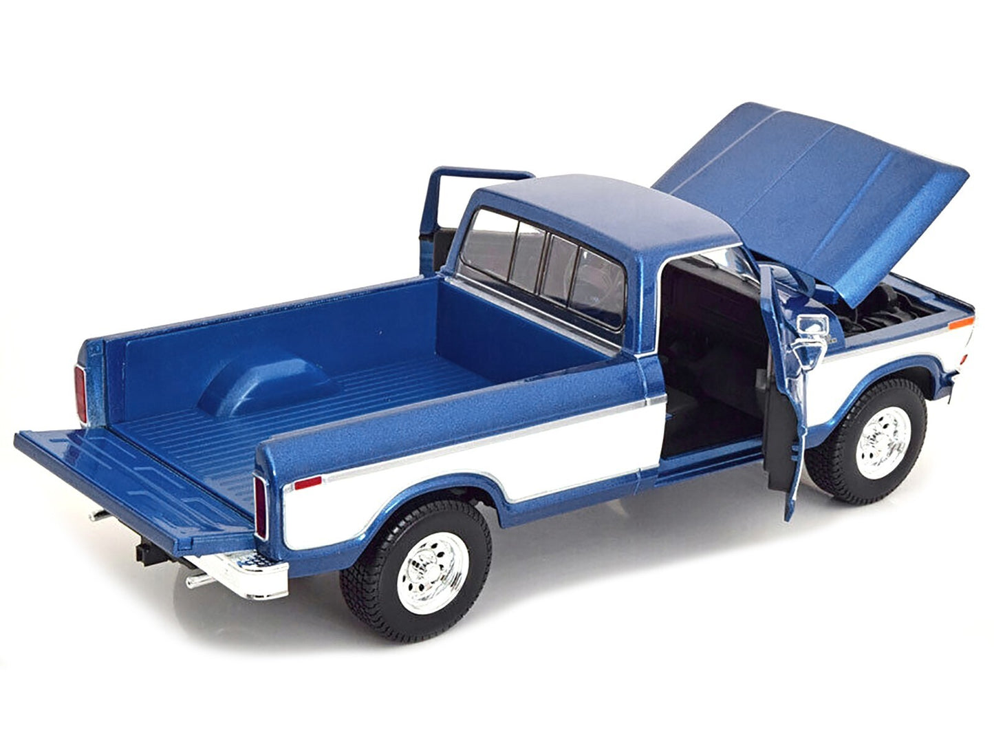 Model of a blue and white pickup truck with open doors on a white background