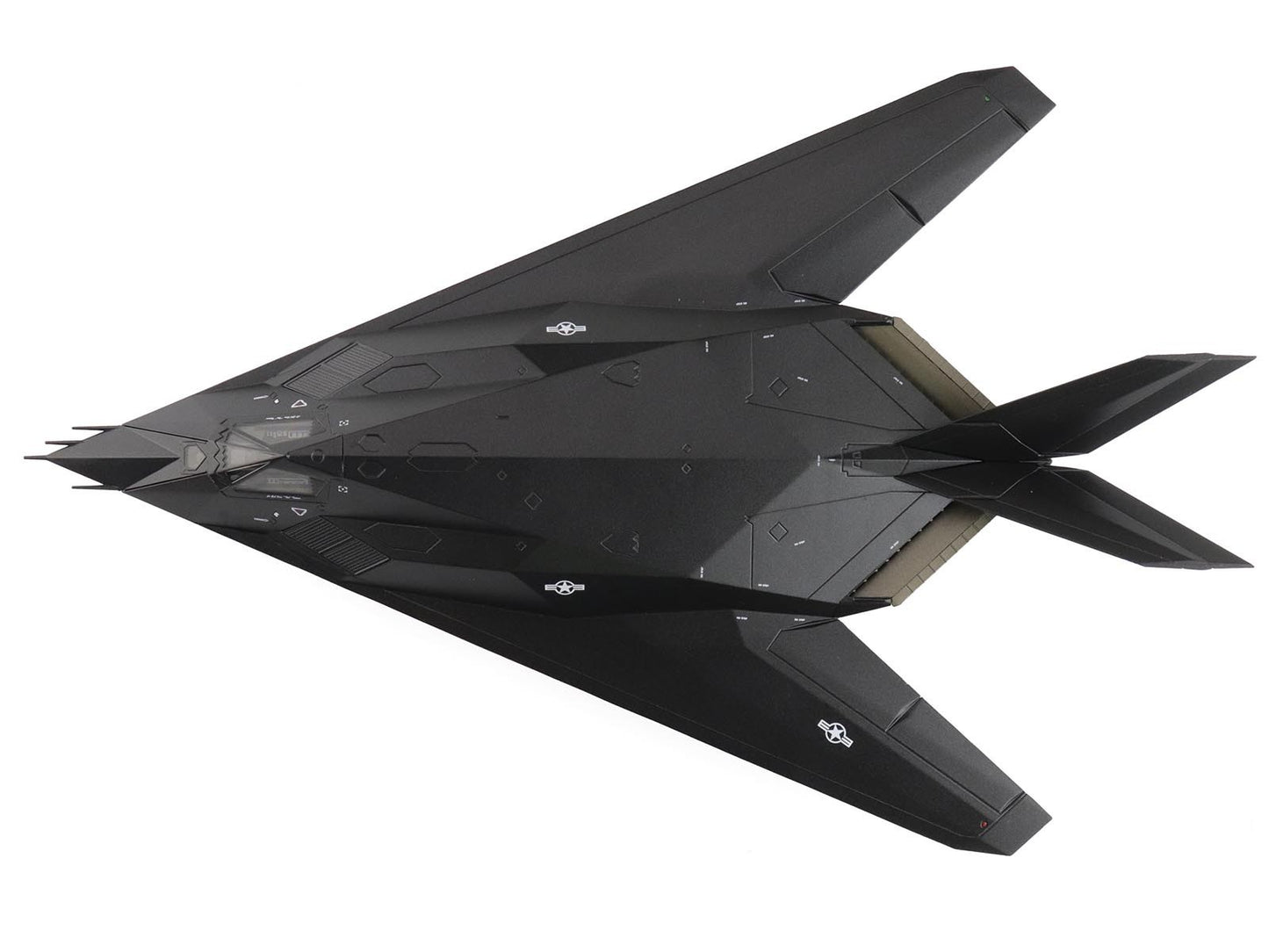 Black stealth aircraft model on a white background