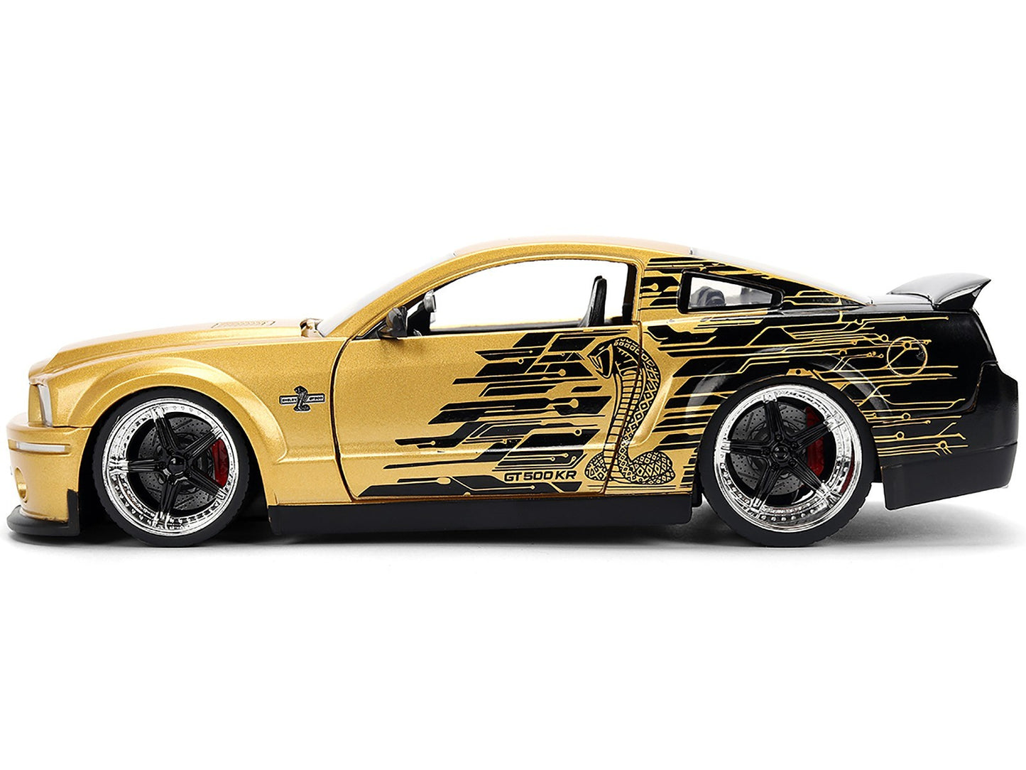 Gold and black sports car with intricate design on a white background