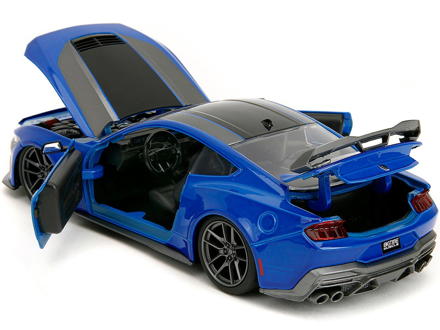 Blue toy car with open doors on a white background