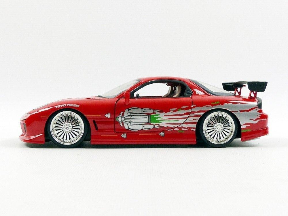 Red toy car with white wheels on a white background