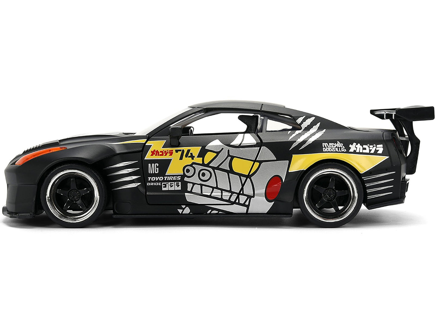 Model car with black, yellow, and white design on a white background