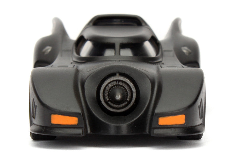 Toy car model of the Batmobile on a white background