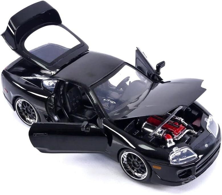 Black model car with open doors and hood on a white background