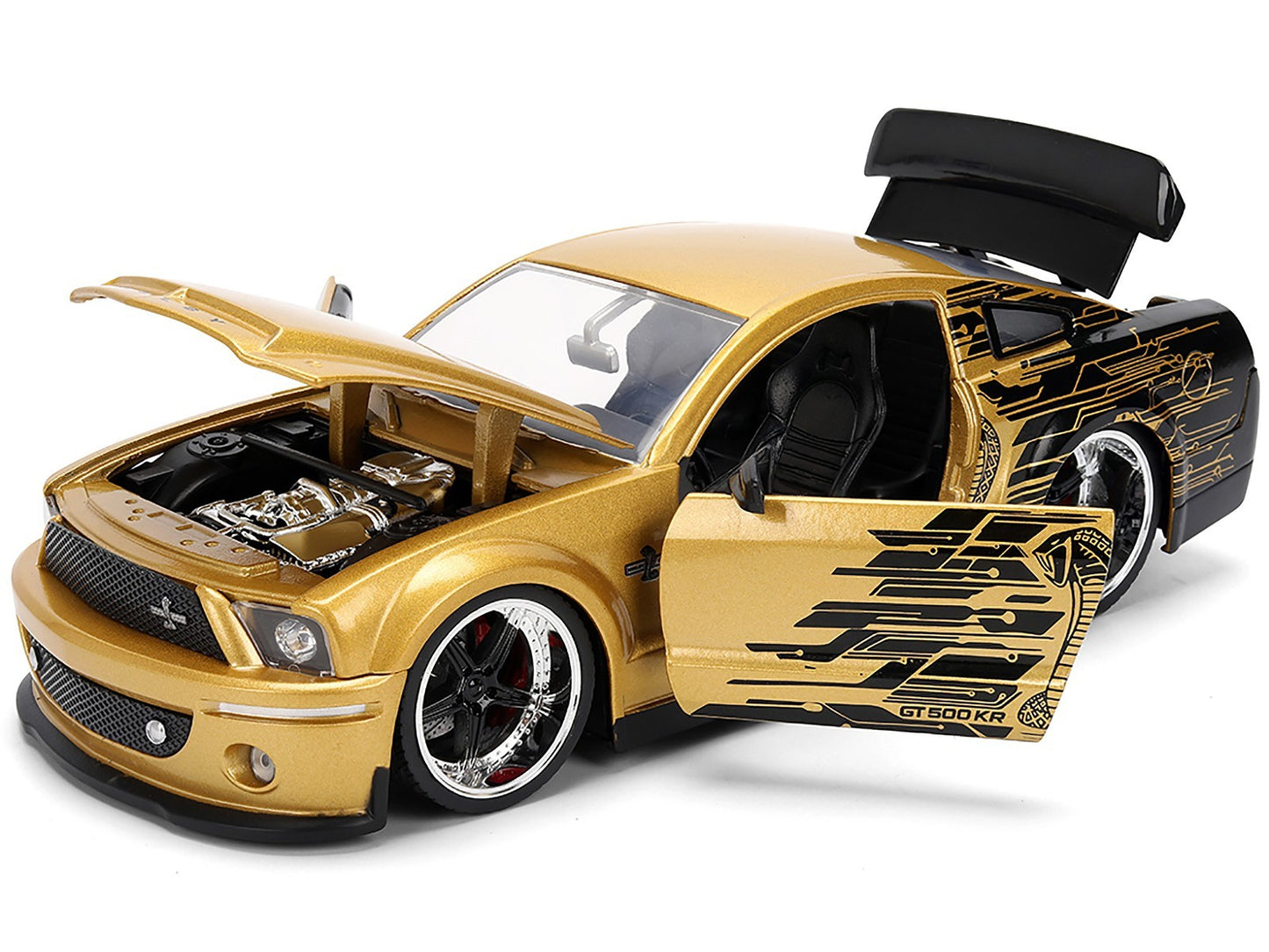 Gold toy car with open door and detailed engine on a white background