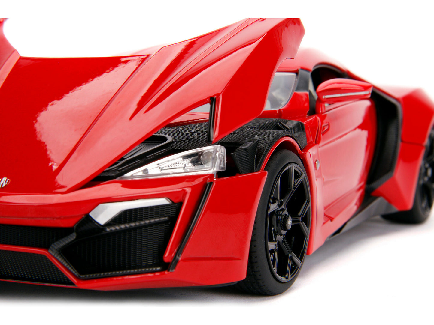 Red sports car model on a white background