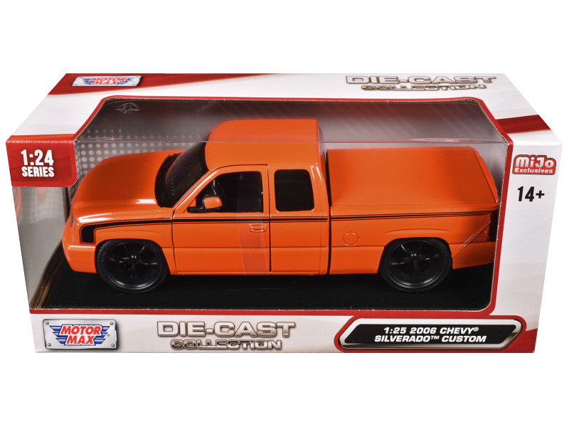 Orange die-cast truck model in packaging with branding on a white background