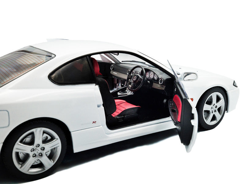 White sports car with open door on a white background