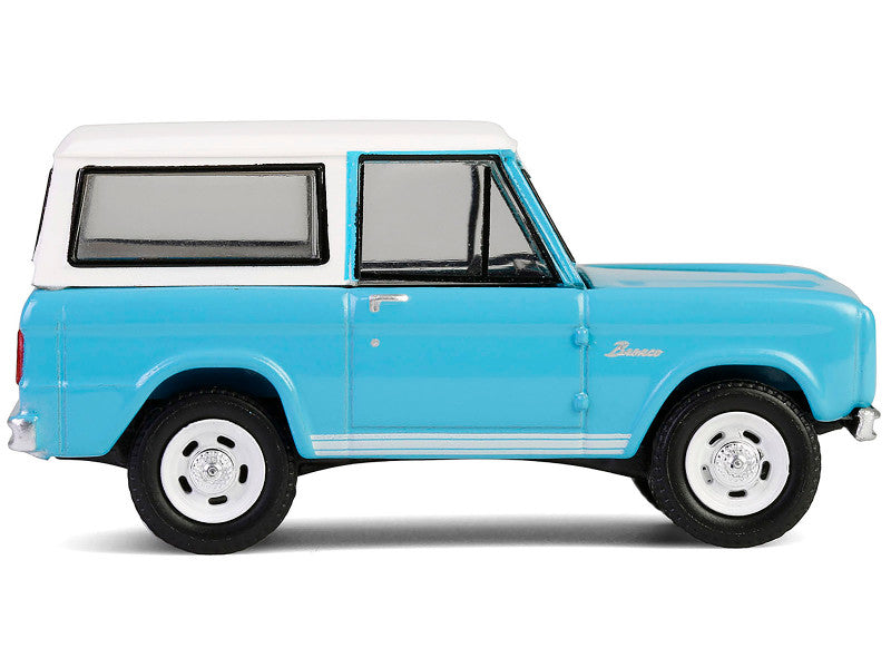 Model of a blue and white vintage truck on a white background