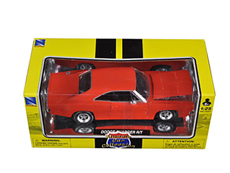Red model car in a yellow box with black stripes on a white background
