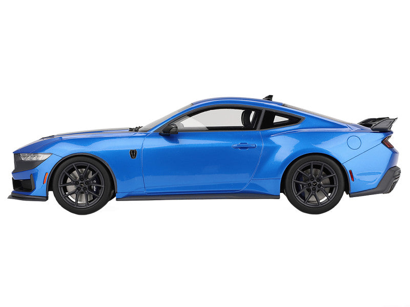 Blue sports car on a white background