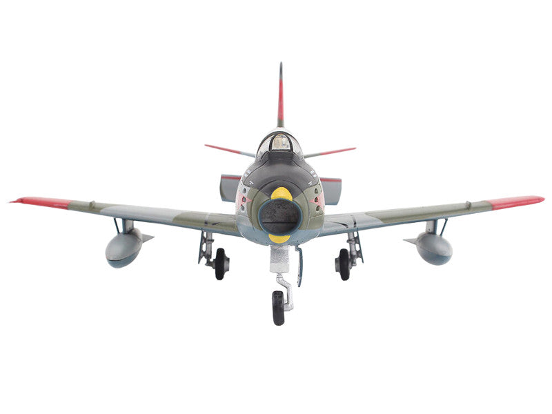 Model of a vintage fighter airplane on a white background