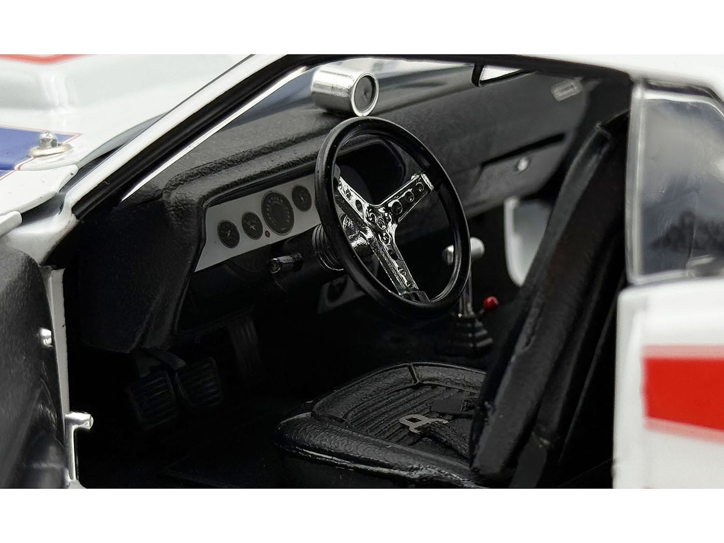 Car interior with steering wheel and dashboard in focus