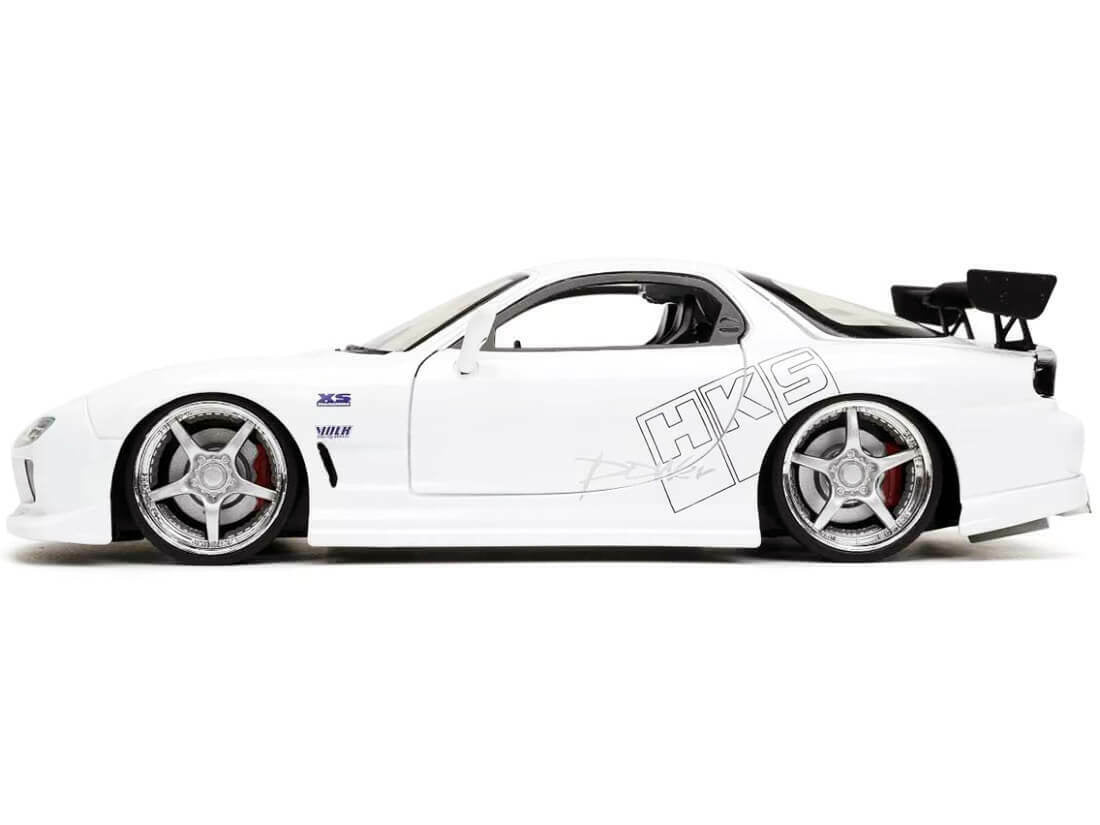White model car with 'HKS' branding on a white background