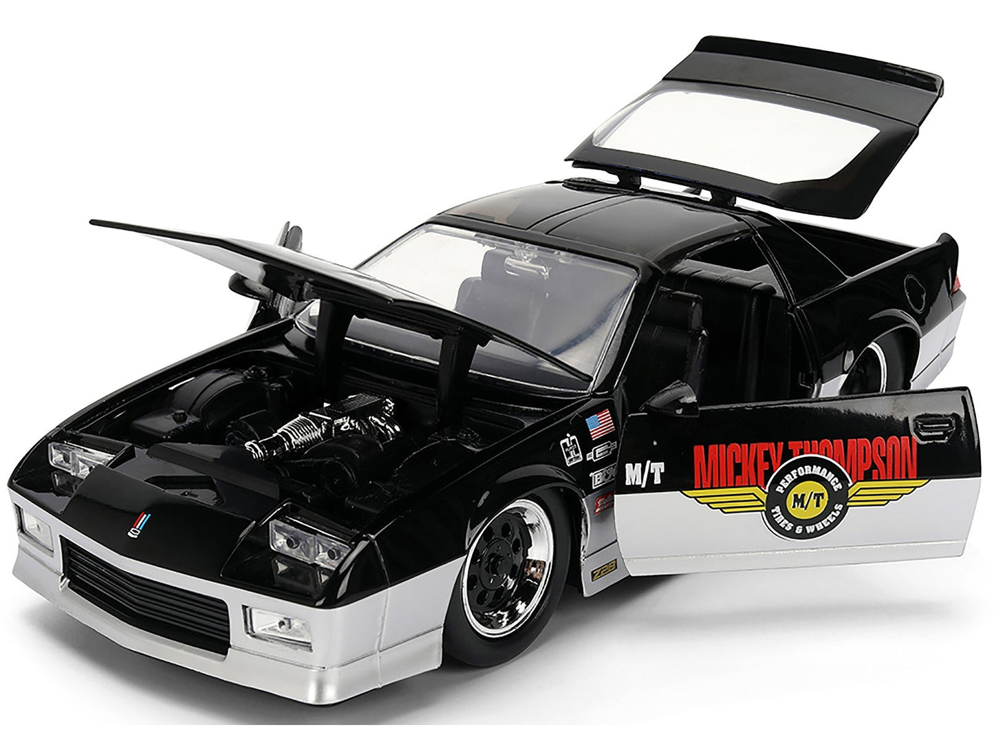 Black and white model car with open doors and hood on a white background
