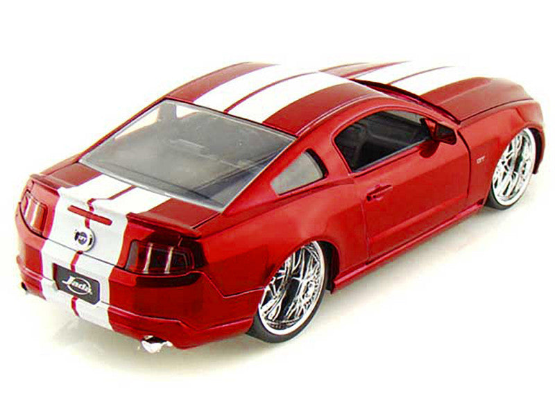 Red and white model car on a white background