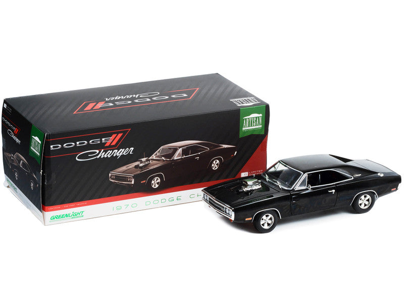 Black model car of a Dodge Charger in front of its packaging box.