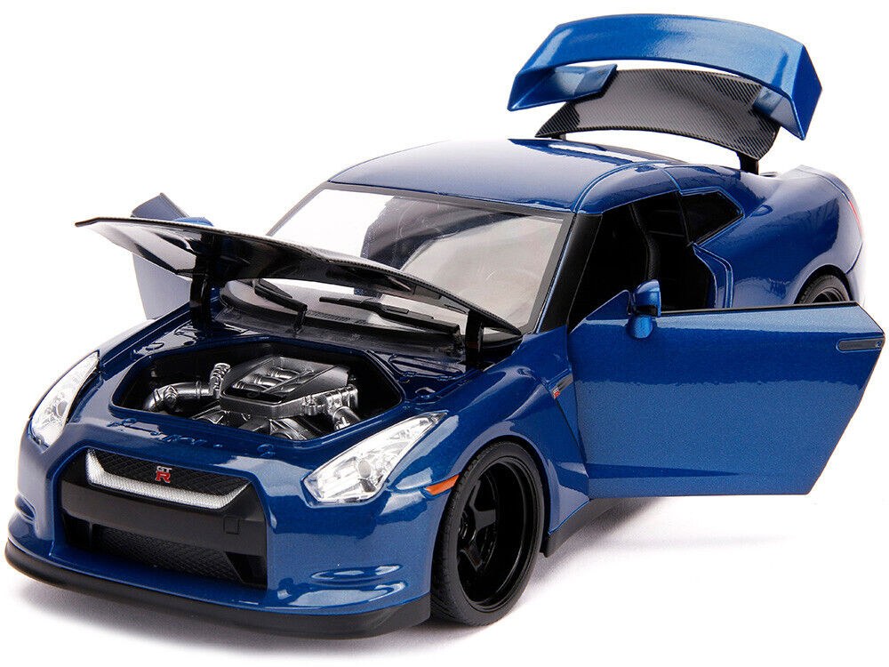 Blue model car with open hood on a white background