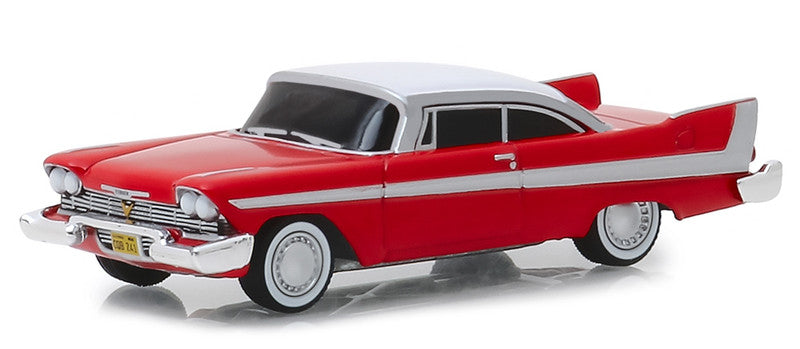 Model of a red classic car with white roof on a white background
