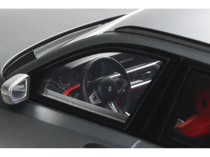 Car dashboard with steering wheel and instrument cluster on a gray background