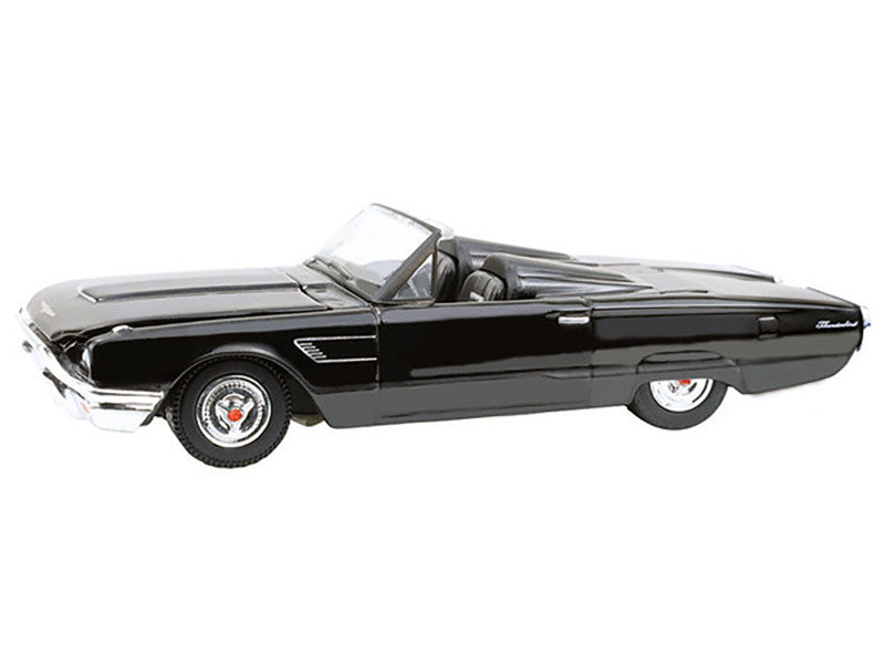 Black convertible car model on a white background