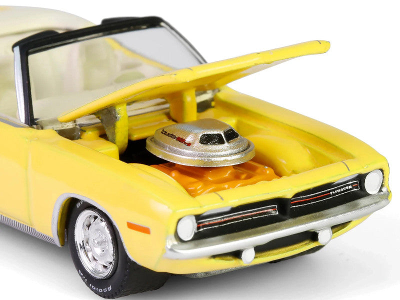Yellow model car with open hood on a white background