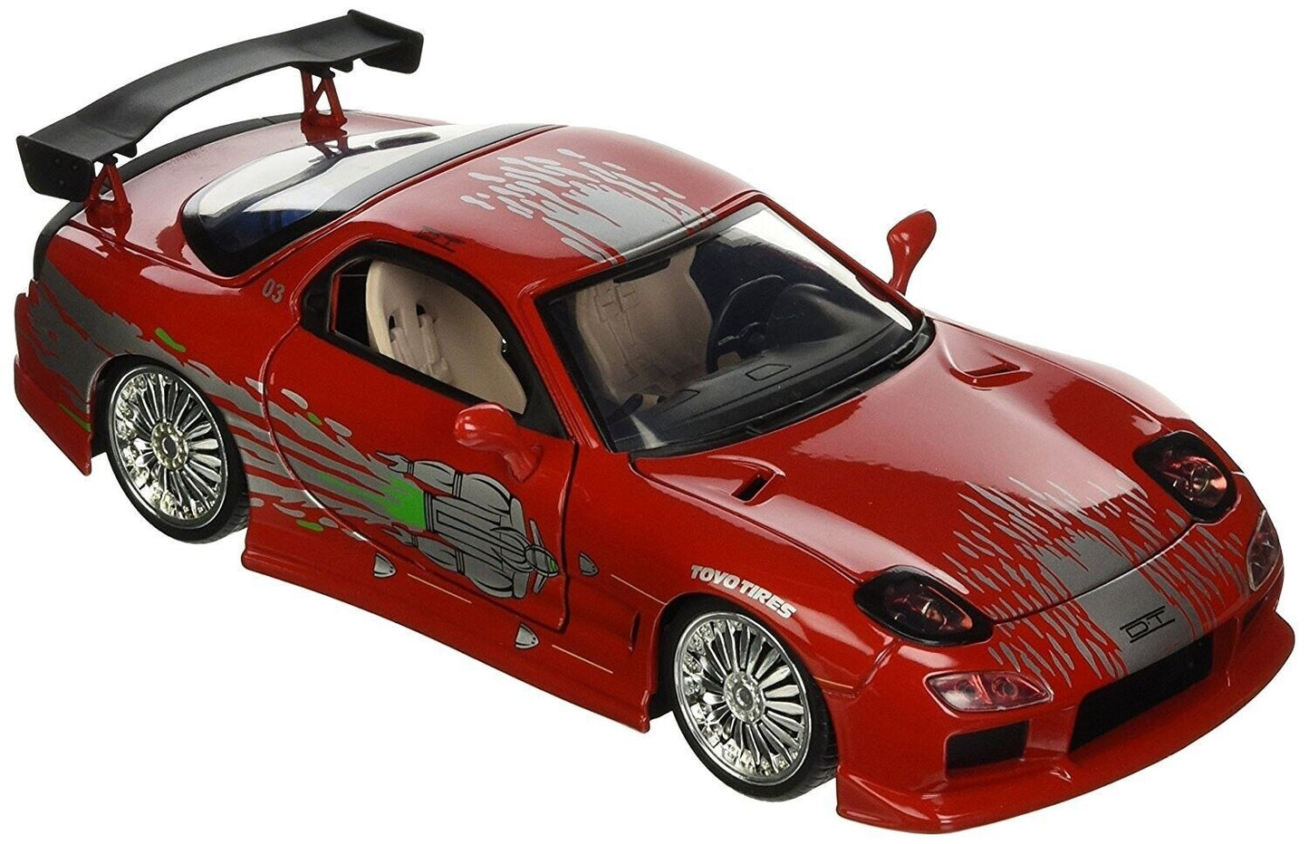 Red toy car with black roof on a white background
