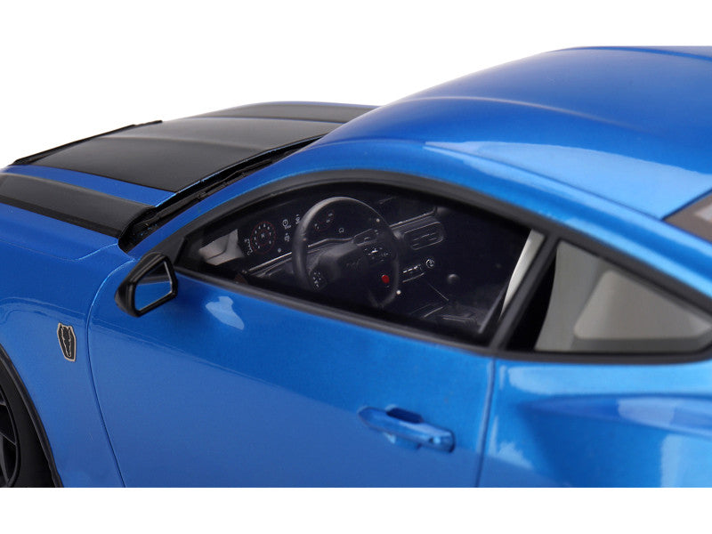Close-up of a blue car's interior with a white background