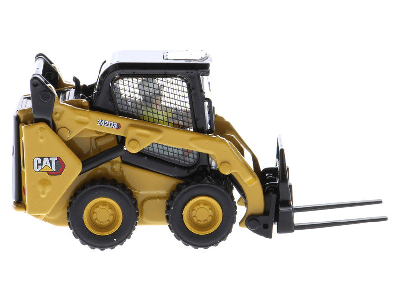 Model of a Caterpillar skid steer loader on a white background