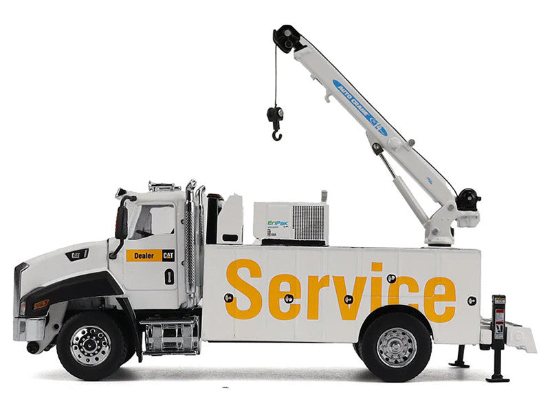 Boom extended on white catipillar service truck