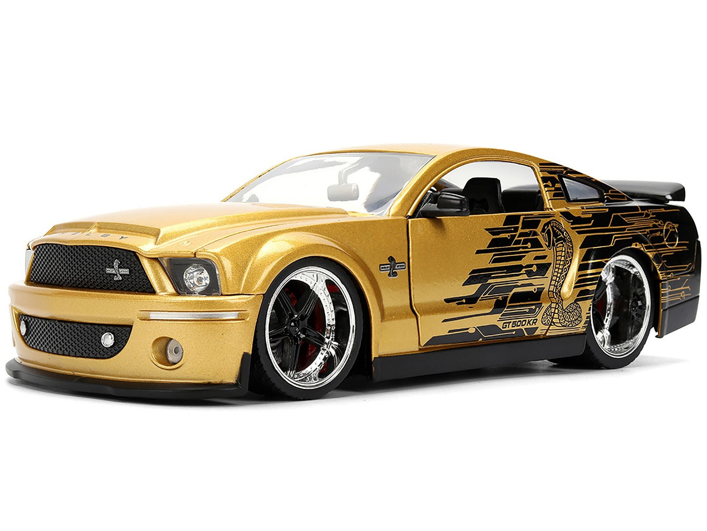 Gold model car with black accents on a white background