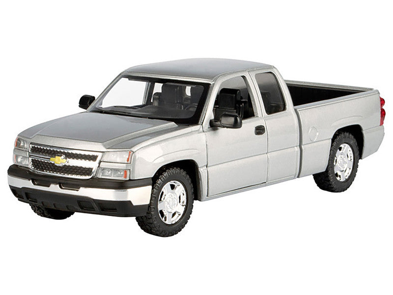 Model of a silver Chevrolet truck on a white background