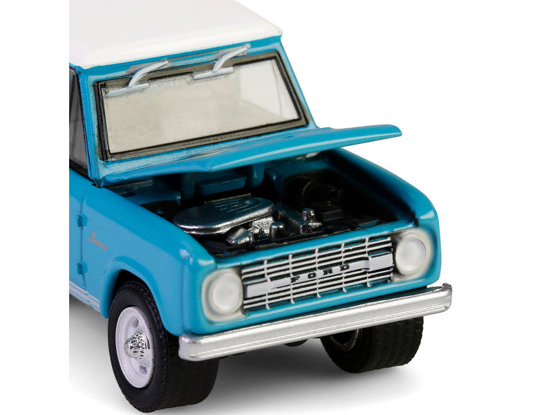 Model car with open hood on a white background