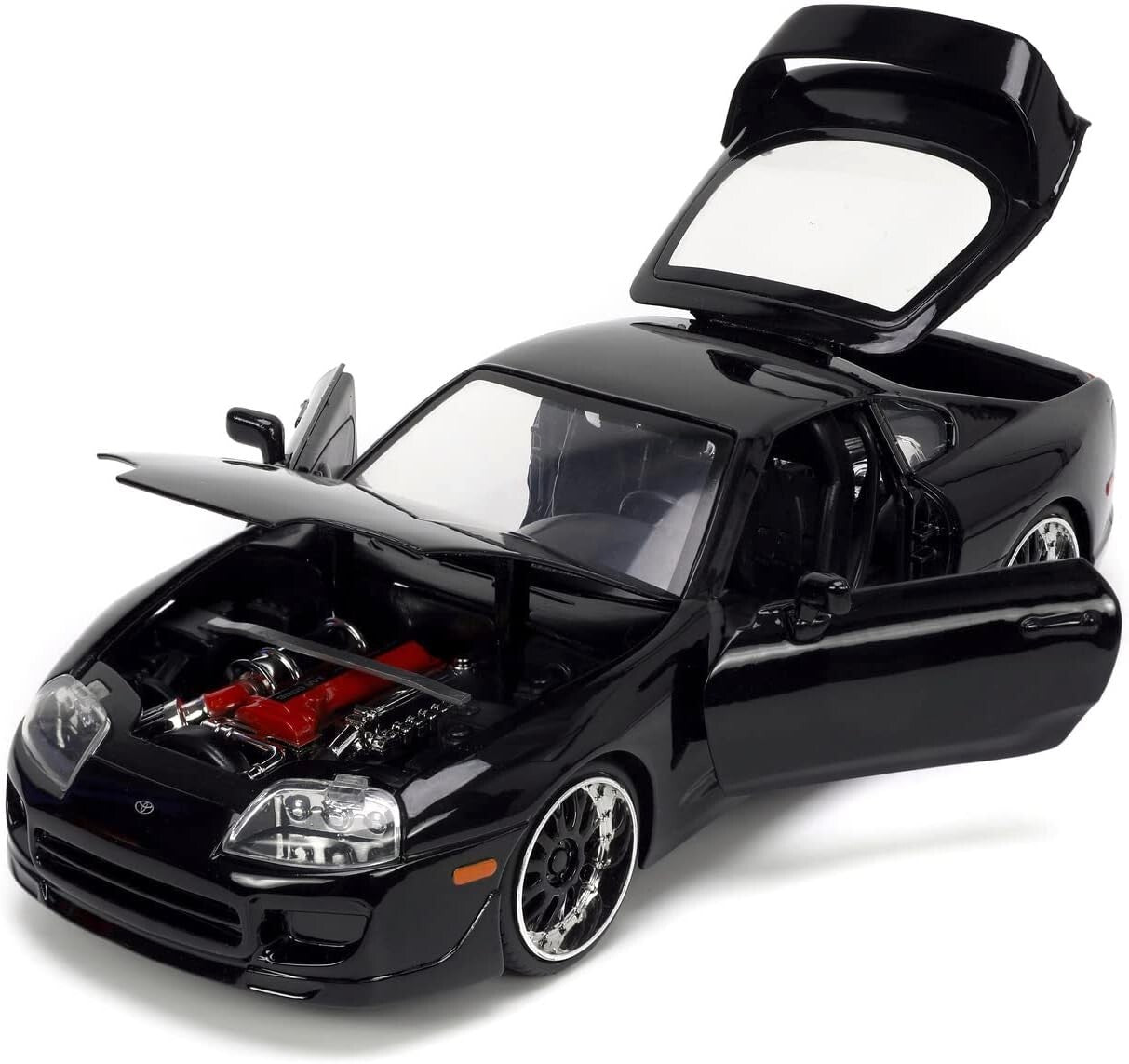 Black model car with open doors on a white background
