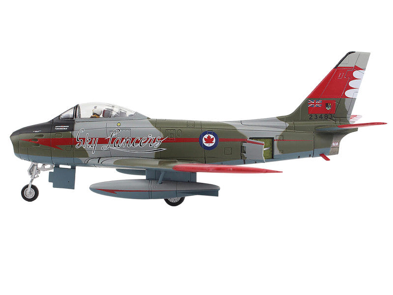 Model of a military aircraft with a red and gray design on a white background