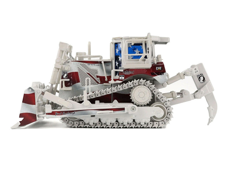 Model of a bulldozer with American flag design on a white background